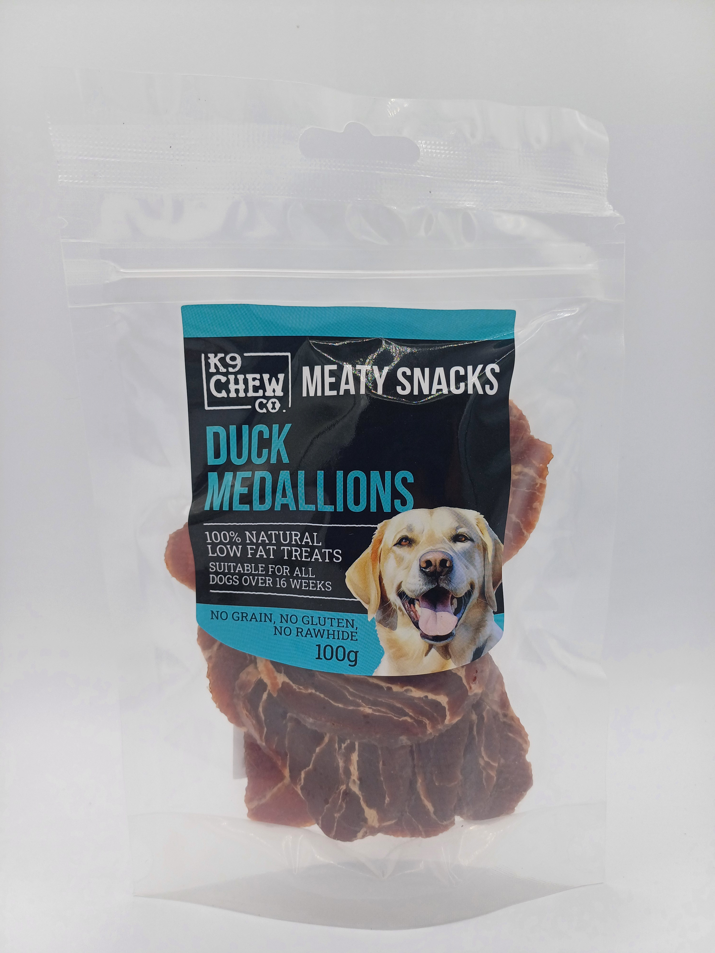 K9 Chew Co meaty snacks packaging with duck medallions on a white background