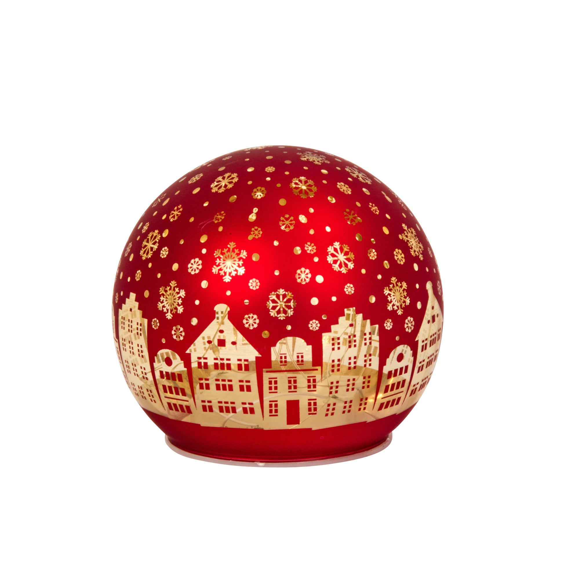 Decorative red ball with gold snowflakes and house silhouettes on a white background
