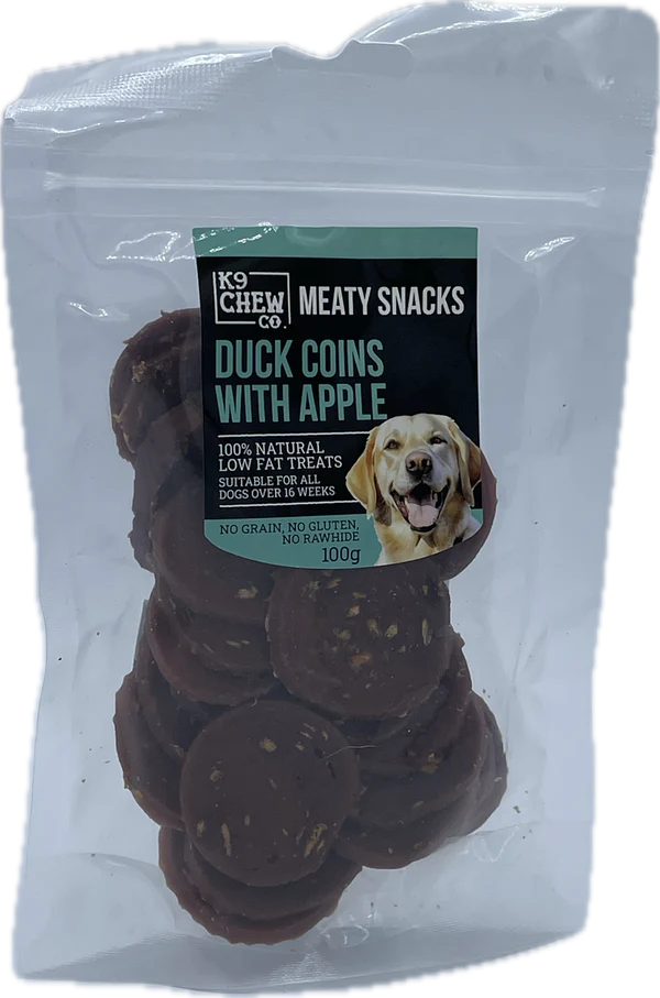 Package of K9 Chew Co meaty snacks with duck coins and apple, suitable for dogs.