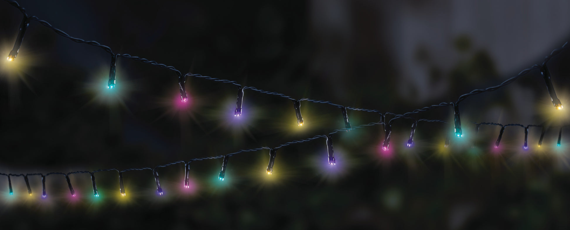 String of colorful lights against a dark background