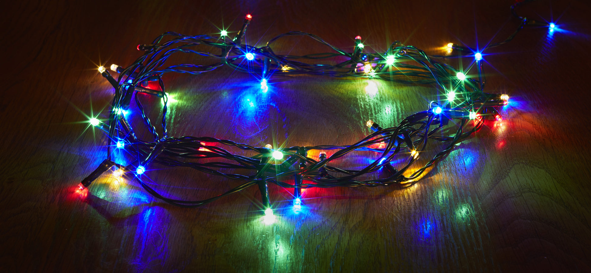 Multicolored string lights on a dark background