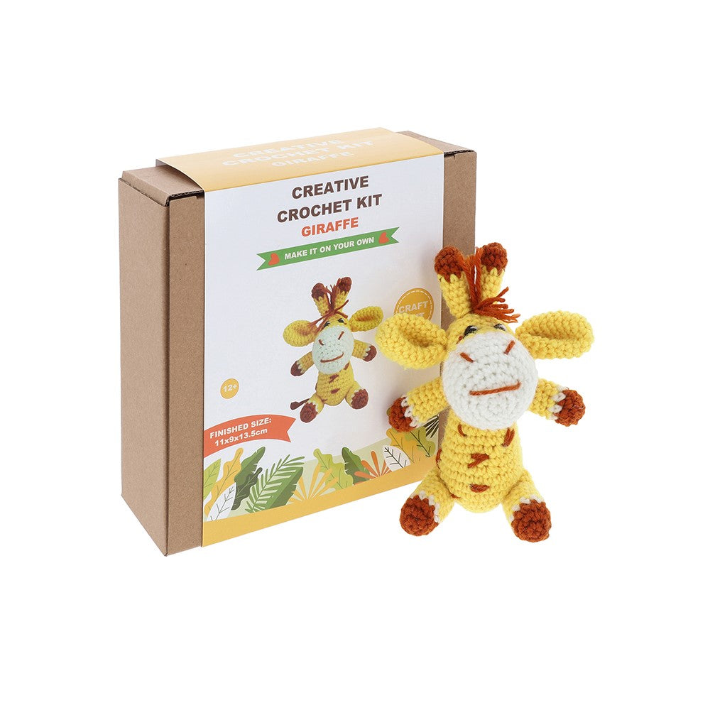 Crochet kit with a giraffe toy and packaging on a white background