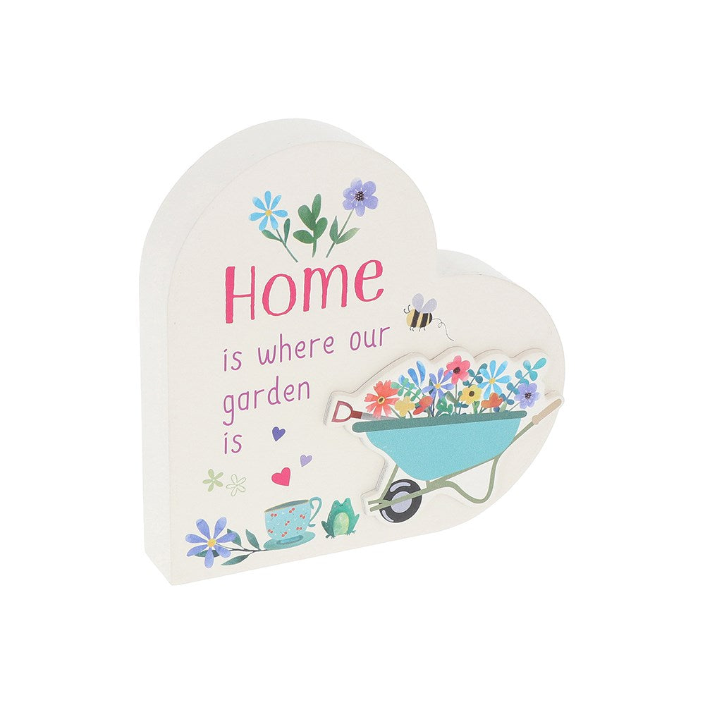 Heart-shaped decorative sign with garden-themed illustrations and 'Home is where our garden is' text on a white background.