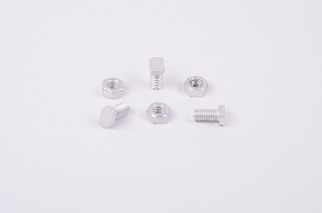 Set of metal screws and nuts on a white background