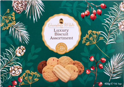 Box of Grandma Wild's Luxury Biscuit Assortment with decorative elements on a green background