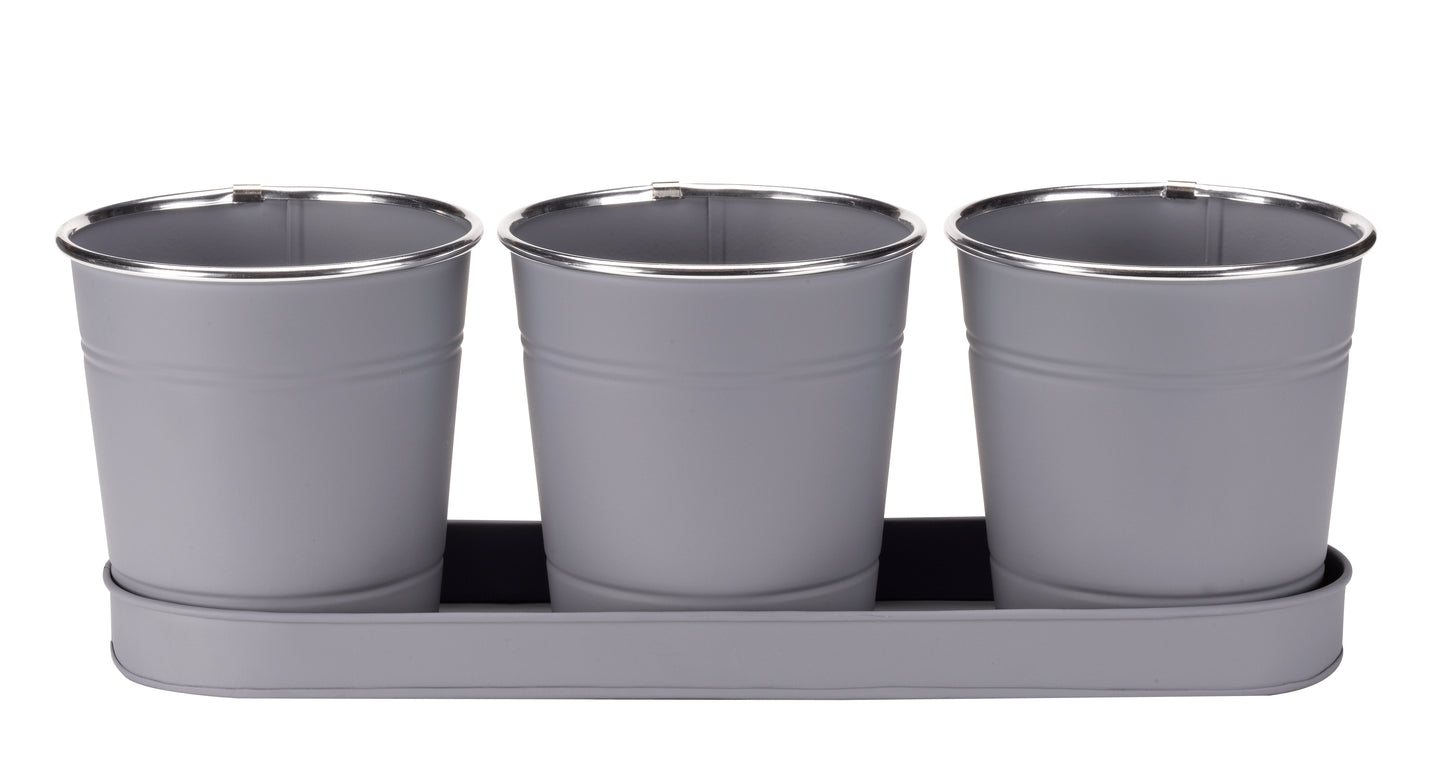 Three gray metal pots with a tray on a white background