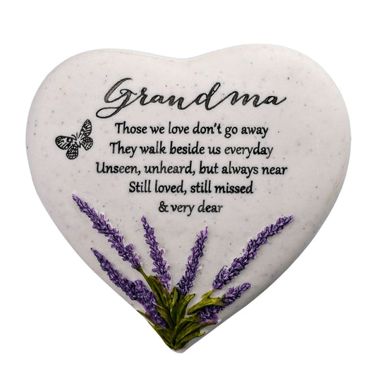 Heart-shaped stone with engraved text and lavender design on a white background