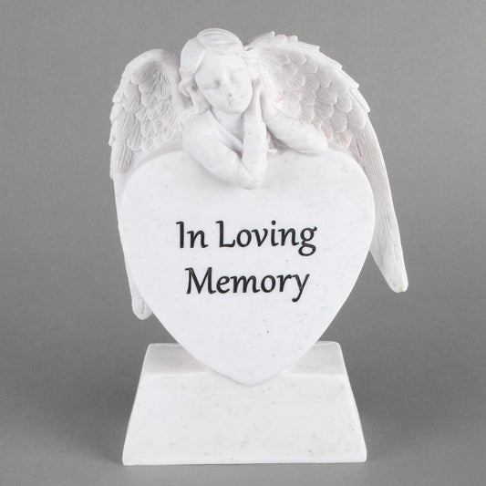 White heart-shaped urn with angel wings and 'In Loving Memory' text on a gray background