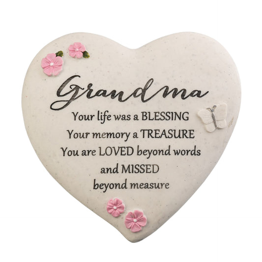 Heart-shaped plaque with a message for grandma on a white background
