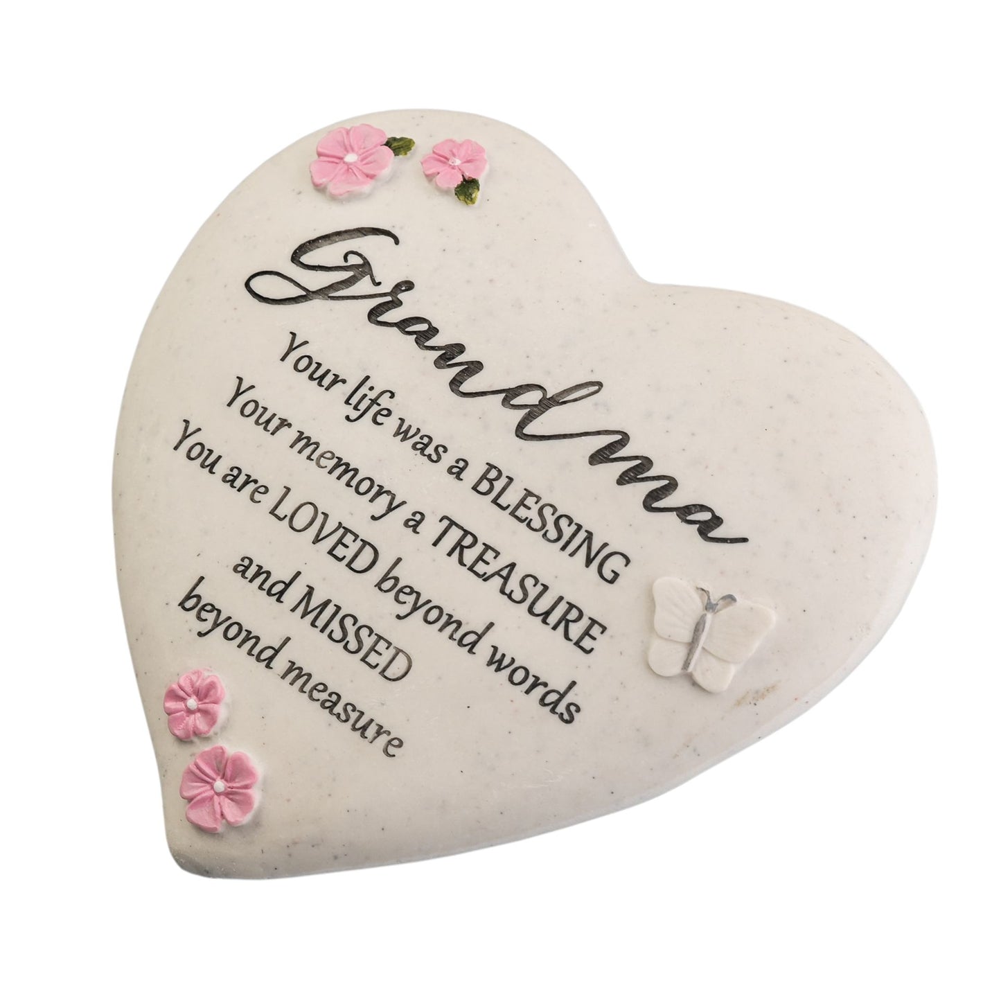Heart-shaped stone with engraved message for grandma on a white background