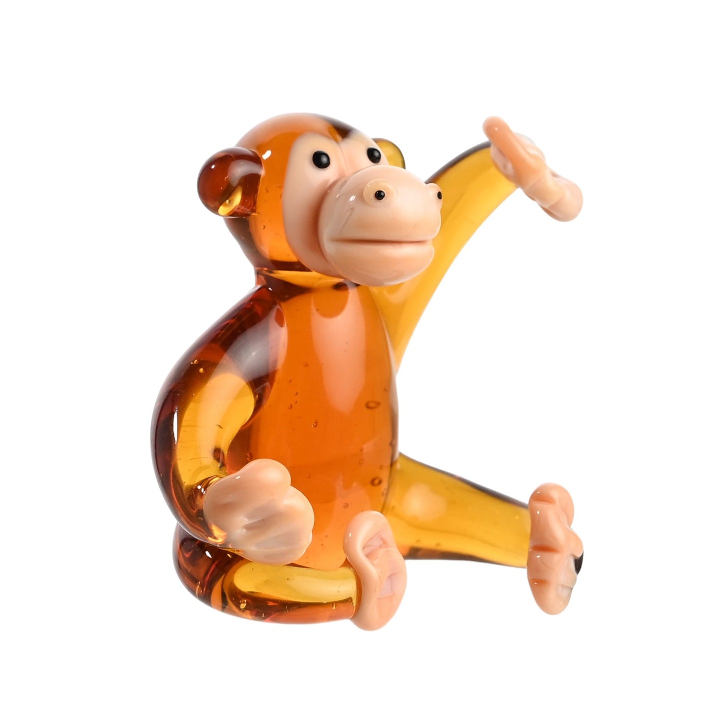 Glass monkey figurine on a white background