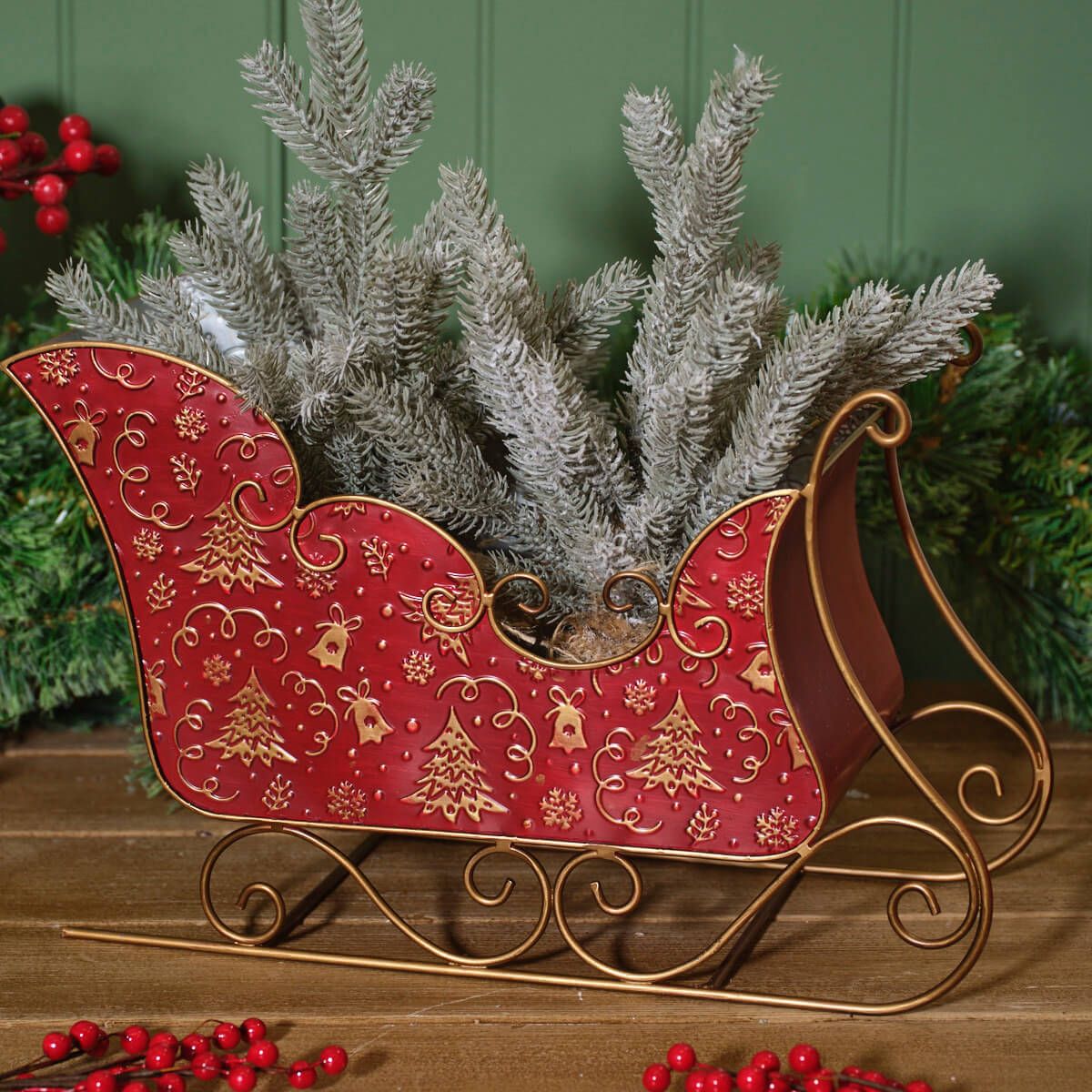 Red and gold metal Christmas sleigh decoration | Large festive ornament with embossed Christmas tree and snowflake pattern | Seasonal display UK
