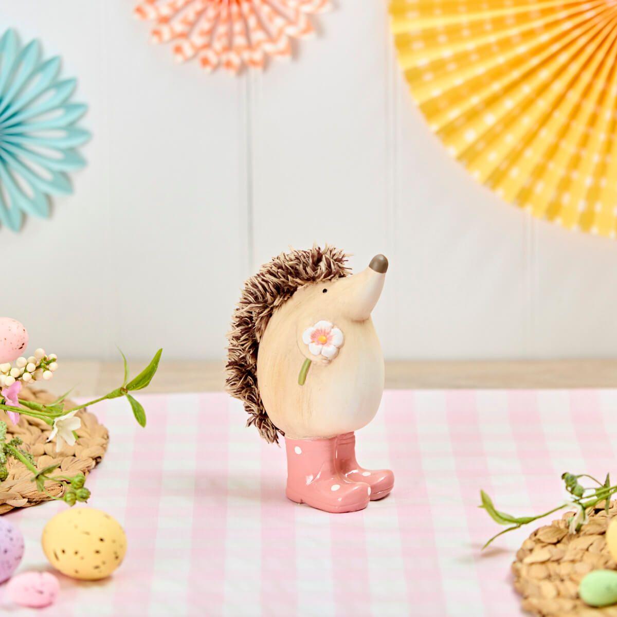Hedgehog Garden Ornament | Resin animal figure standing in pink spotted wellington boots with a painted flower detail | UK garden décor