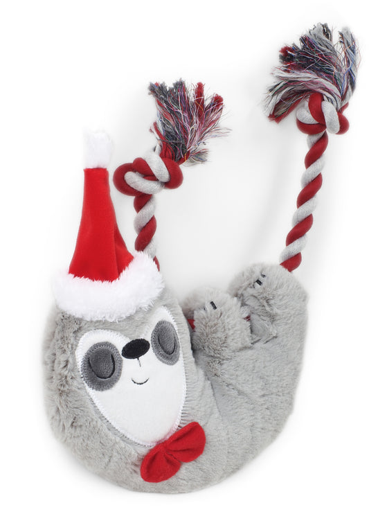 Plush sloth toy with a Santa hat and red bow on a white background