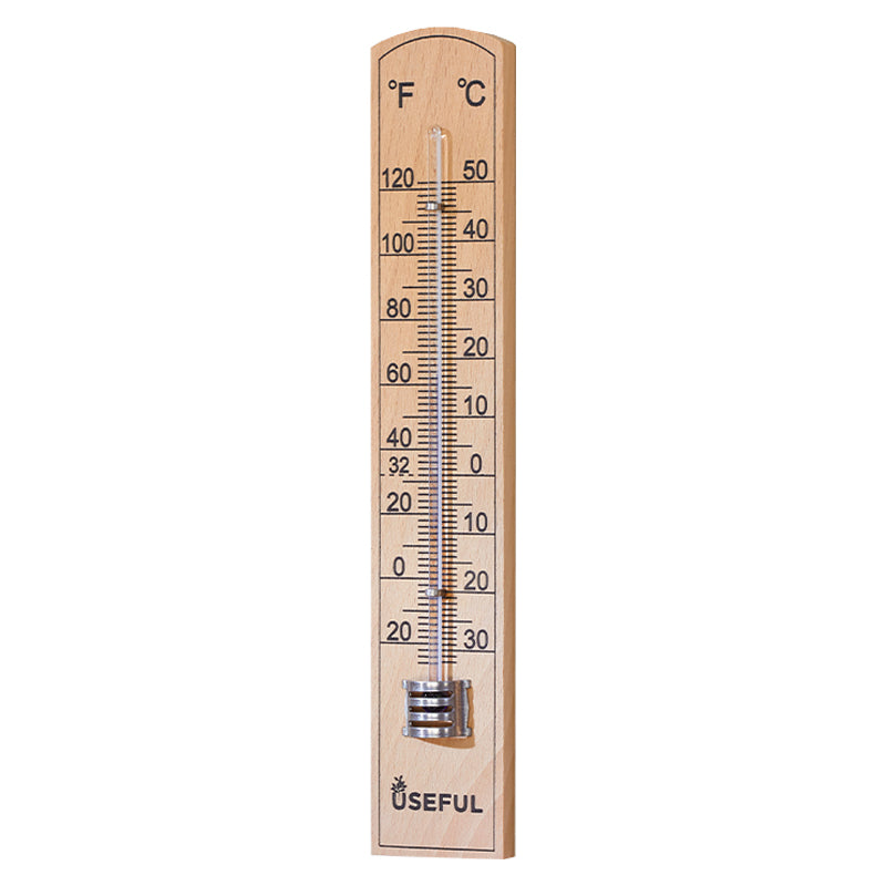 Wooden thermometer with temperature measurement scale on a white background