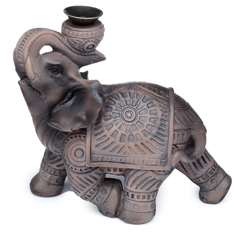 Decorative elephant statue with intricate patterns on a white background