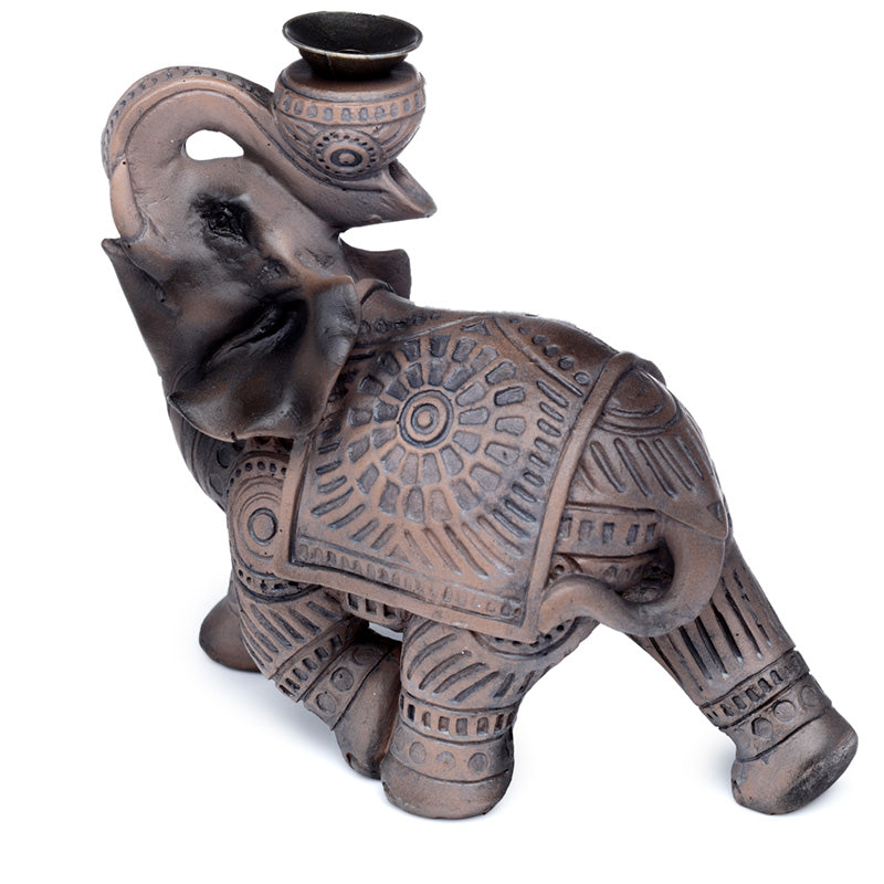 Decorative elephant figurine with intricate patterns on a white background
