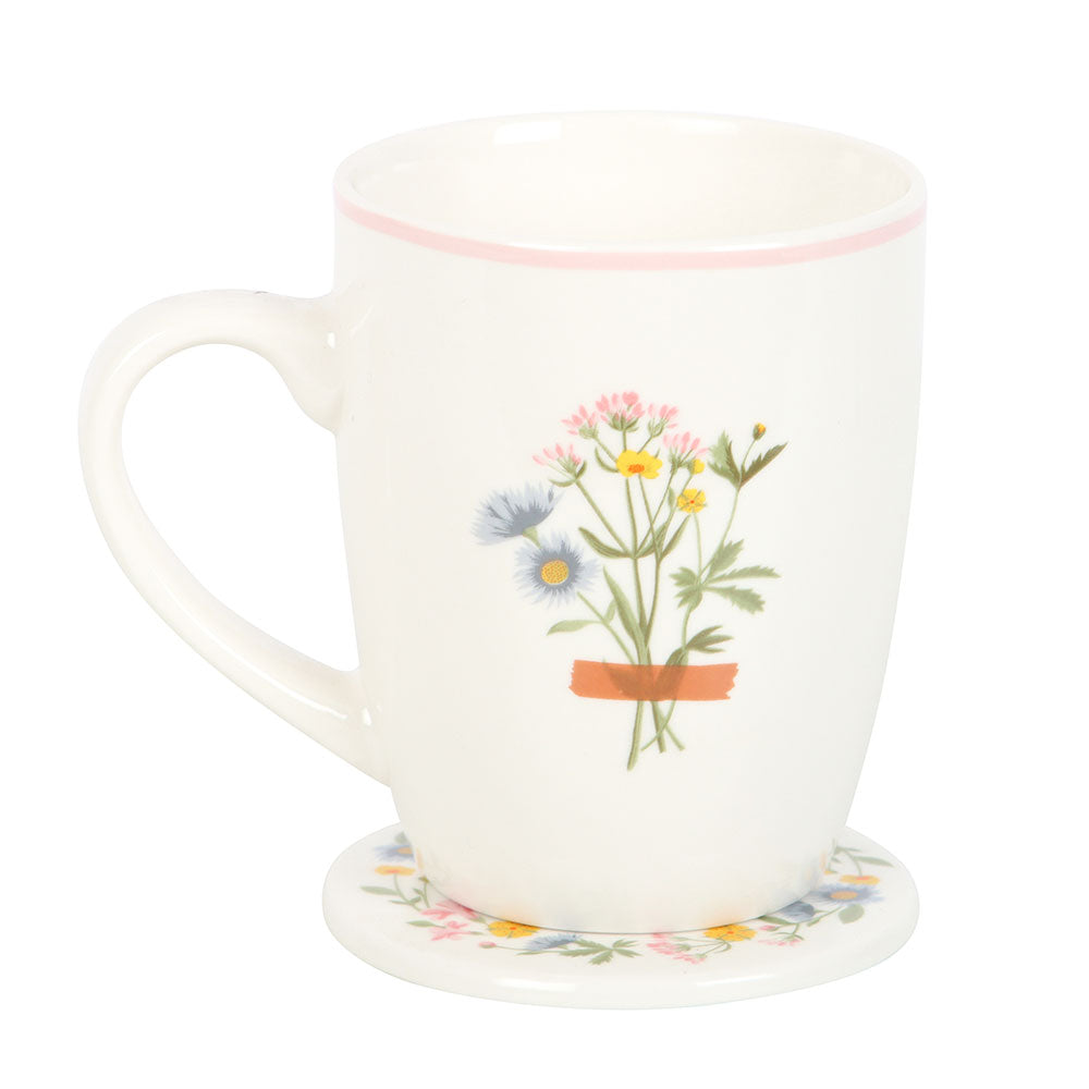 White mug with floral design on a white background