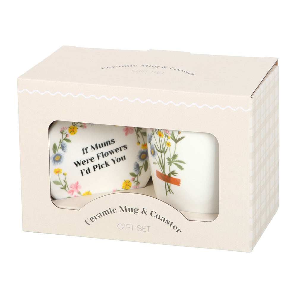 Ceramic mug and coaster set in a box with floral designs and text.