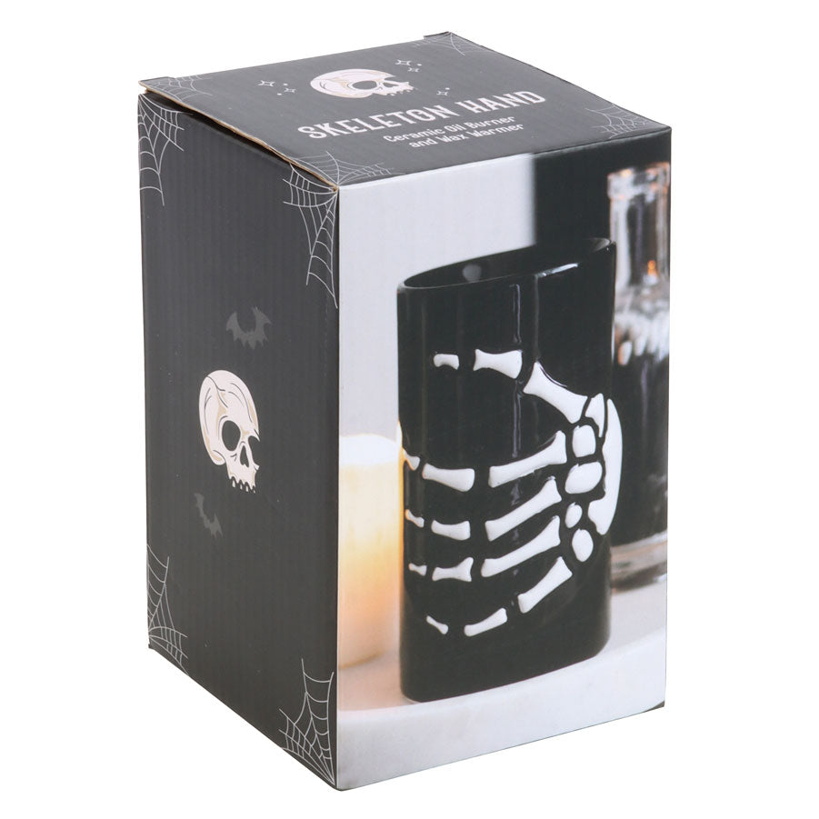 Black skeleton hand mug in packaging with Halloween-themed design