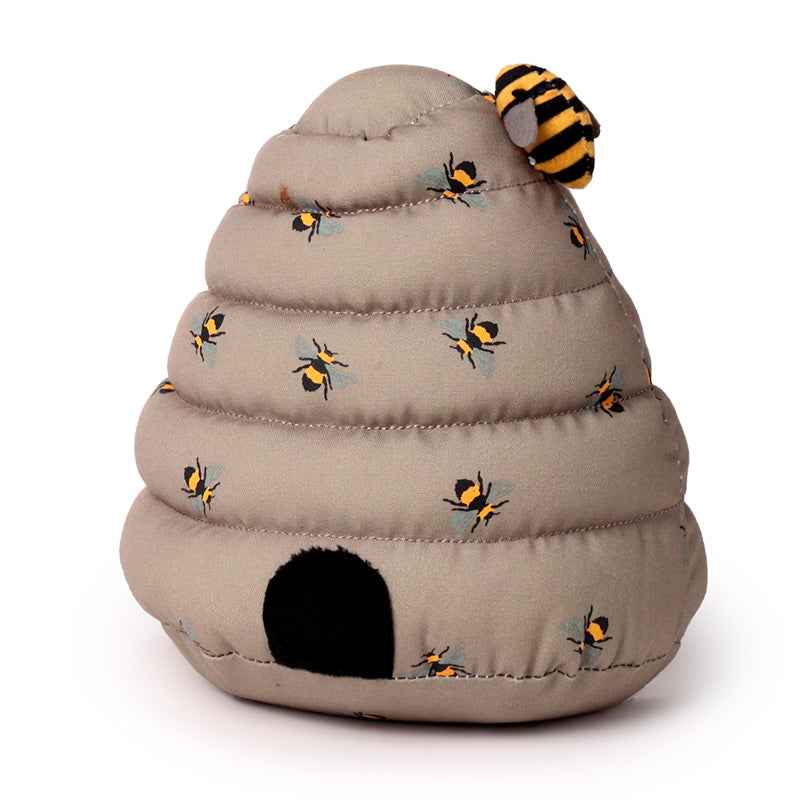 Toy beehive with bees on a white background