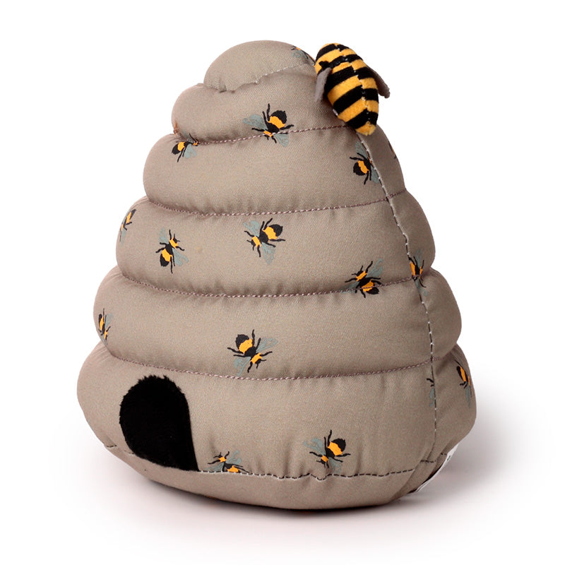 Toy bee hive with bees on a white background