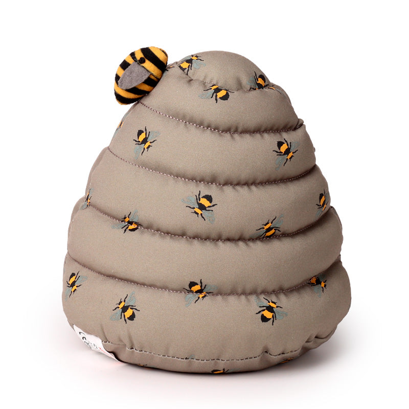 Toy beehive with bees on a white background
