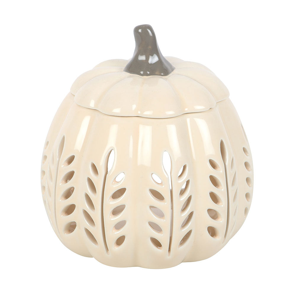 Ceramic pumpkin-shaped lantern with cut-out leaf patterns on a white background