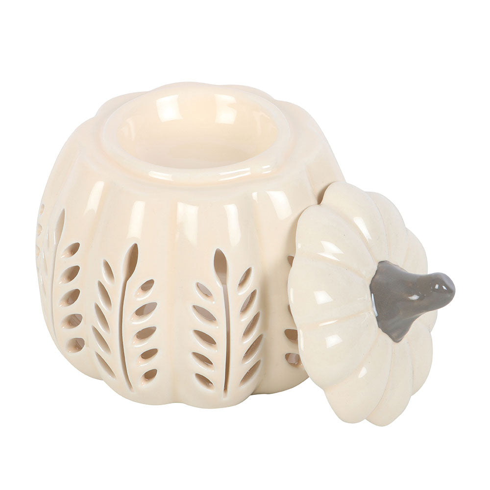 White ceramic pumpkin-shaped lantern with cut-out design on a white background