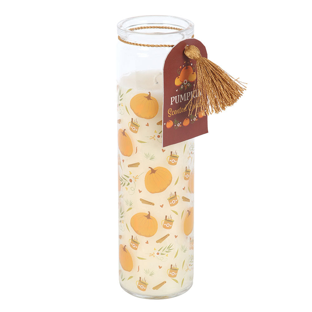 Candle with pumpkin design and label on a white background