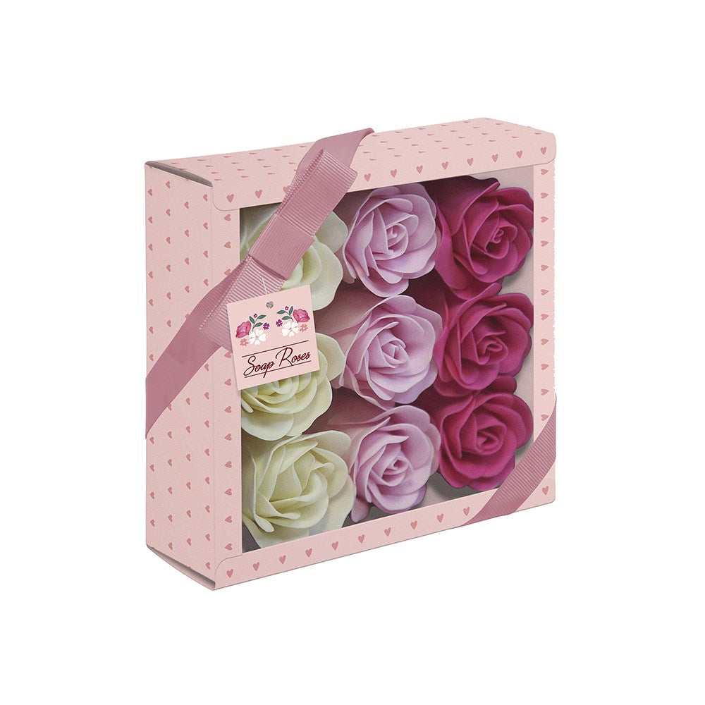 Set of soap roses in a decorative box with a pink ribbon on a white background