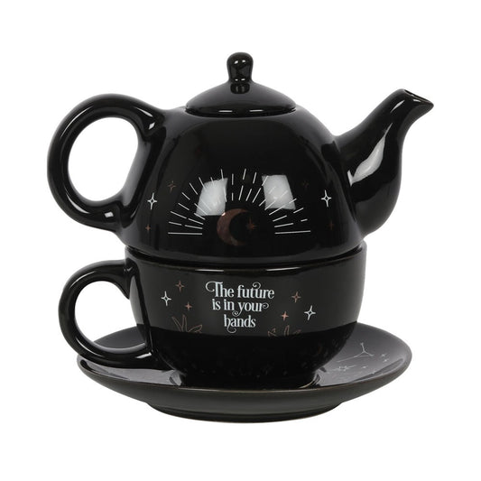 Black teapot and mug set with 'The future is in your hands' text on a white background