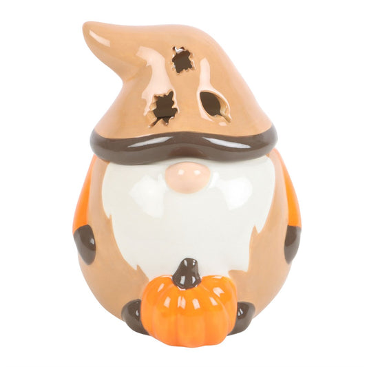 Ceramic gnome figurine with a witch hat and pumpkin on a white background