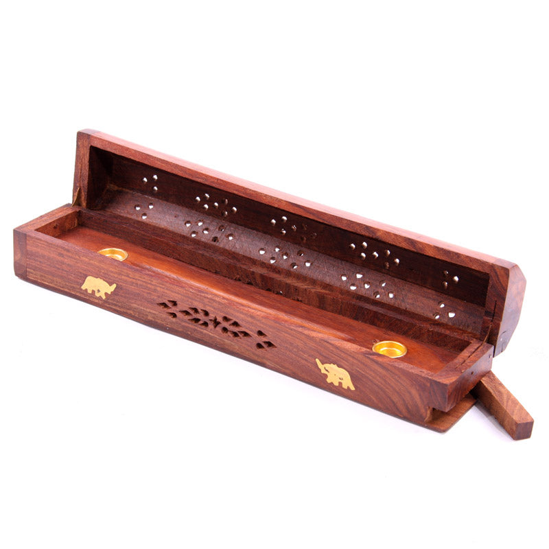 Wooden incense holder with elephant designs on a white background
