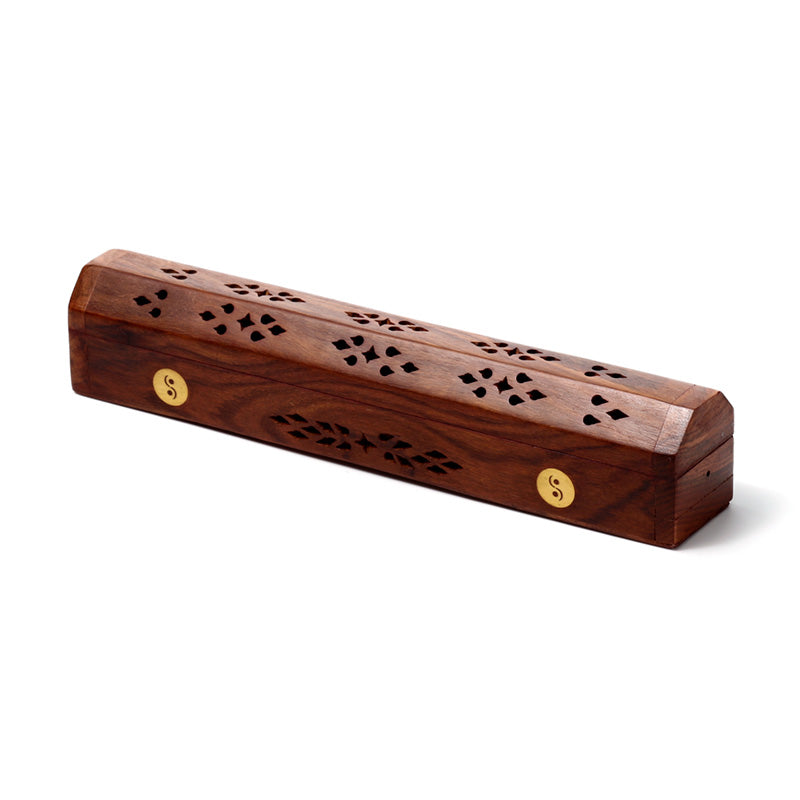 Wooden incense holder with decorative patterns on a white background