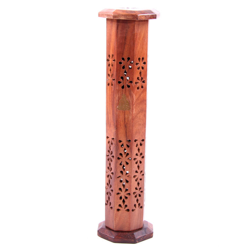 Wooden incense burner with floral patterns on a white background