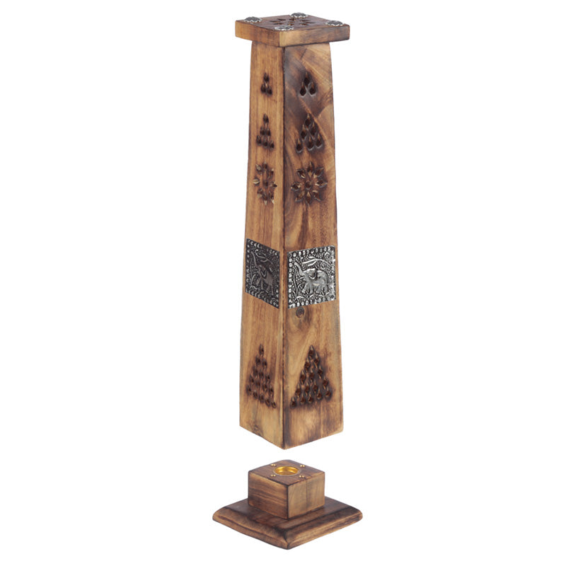 Wooden incense burner with decorative elements on a white background