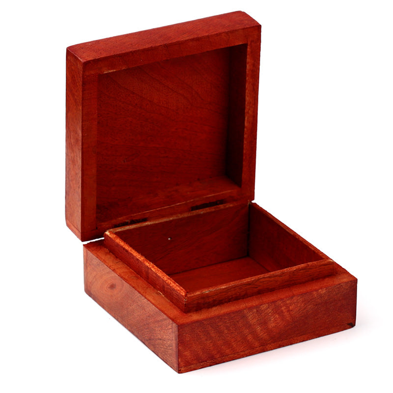 Wooden jewelry box with a lid open on a white background