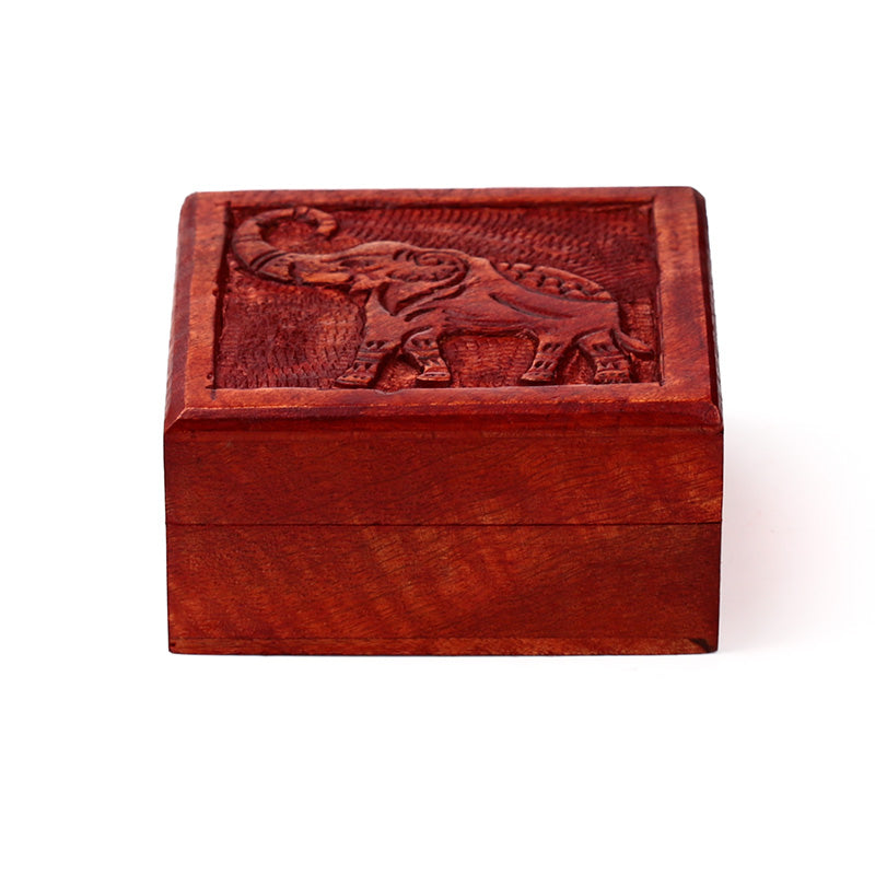 Wooden box with an elephant design on a white background