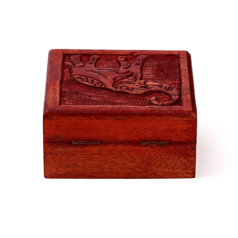 Wooden box with an embossed design on a white background