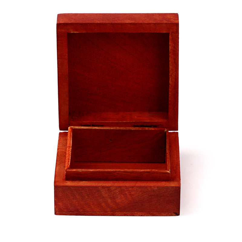 Open wooden jewelry box on a white background