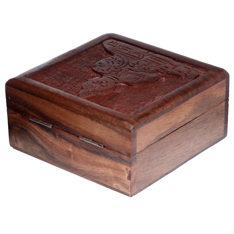 Wooden box with a decorative top on a white background