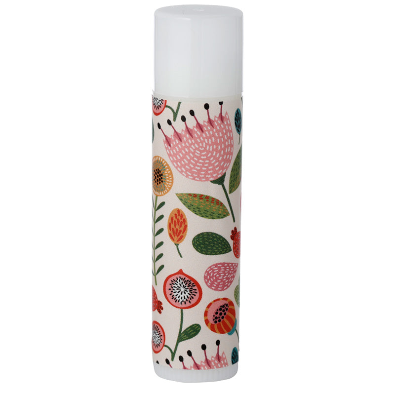 Cylindrical candle with floral pattern on a white background