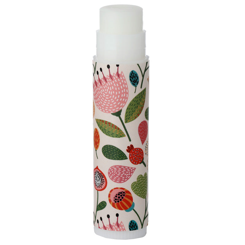 Lip balm with floral design on a white background