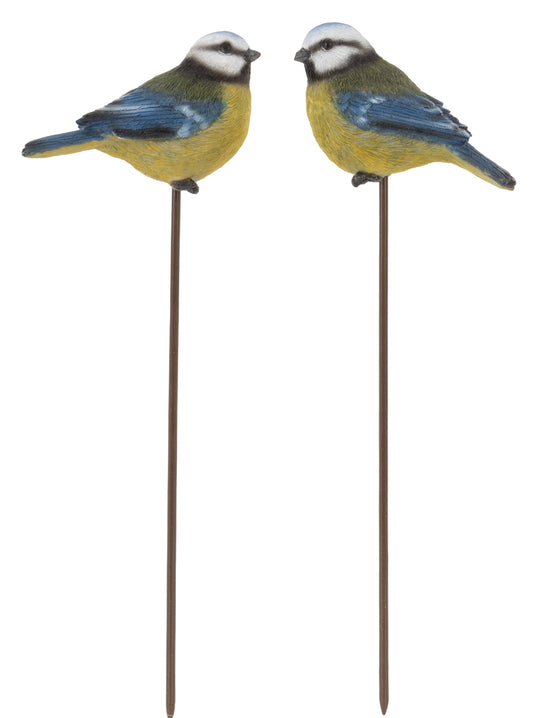 Two decorative bird stakes on metal stands against a white background
