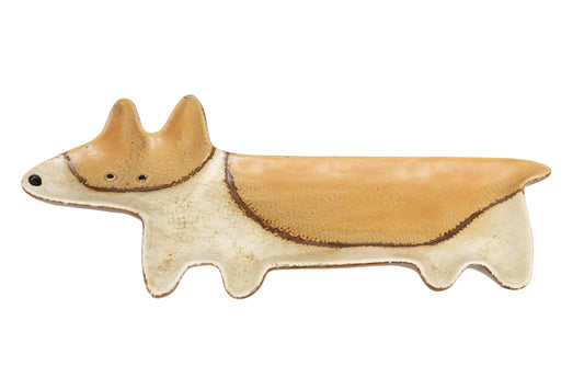 Ceramic dog figurine on a white background