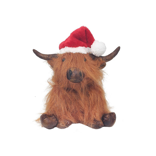 Plush toy of a brown animal wearing a Santa hat on a white background