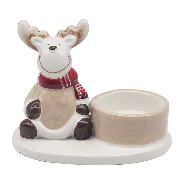 Ceramic reindeer with a red scarf holding a round container on a white background