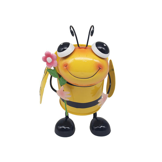 Colorful bee figurine holding a flower on a white background