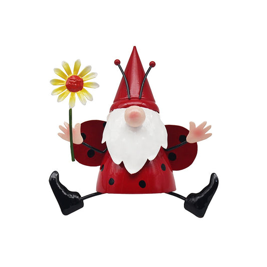 Gnome figurine with a red hat and white beard holding a yellow flower on a white background
